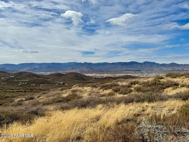 a view of an ocean and mountain