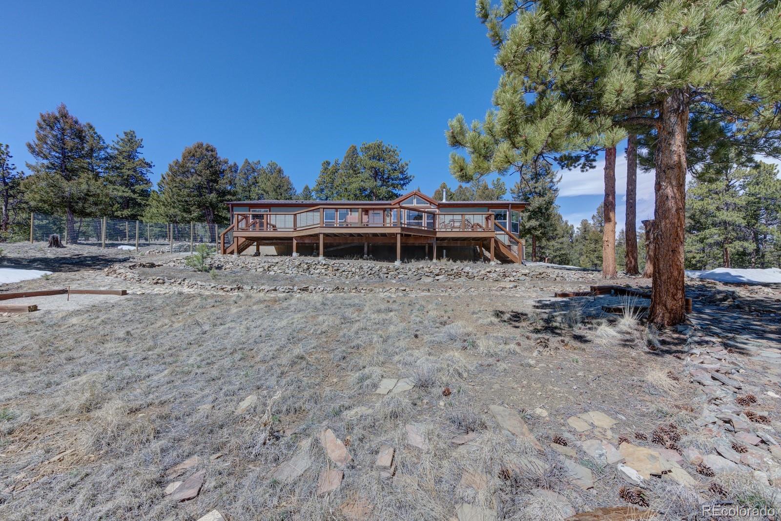 1373 Singletree Road Hartsel, CO 80449 - Photo 1 of 40 a view of house with outdoor space and seating area