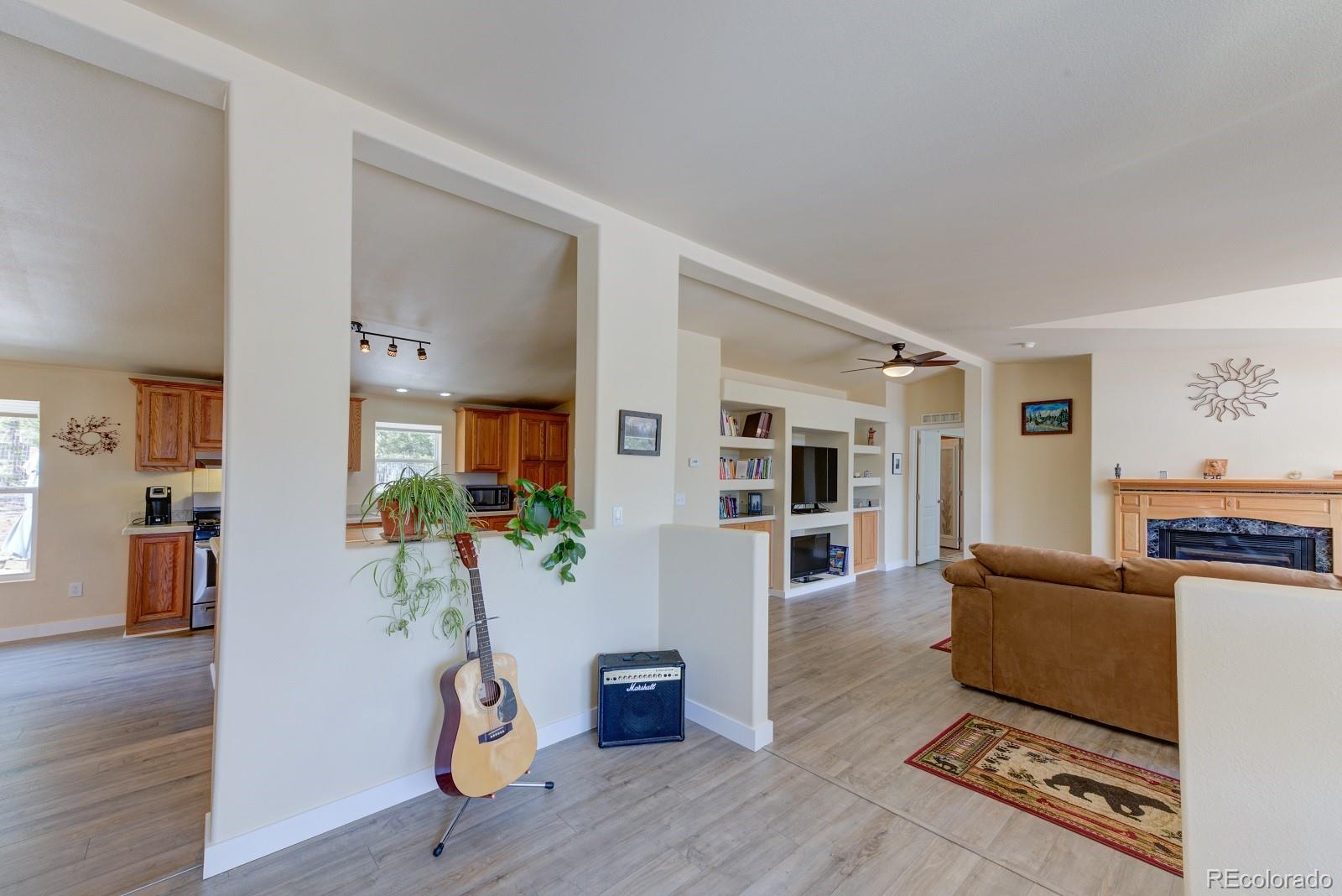 1373 Singletree Road Hartsel, CO 80449 - Photo 13 of 40 a living room with furniture and wooden floor
