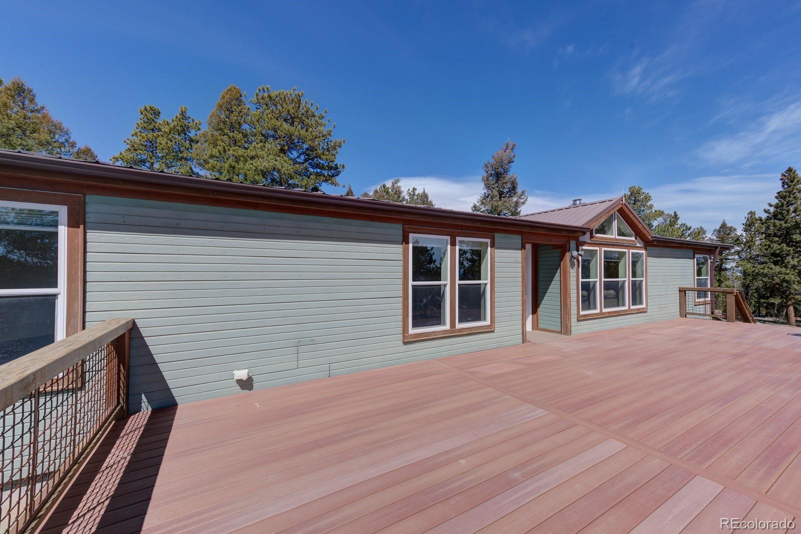 1373 Singletree Road Hartsel, CO 80449 - Photo 3 of 40 a view of a house with a backyard