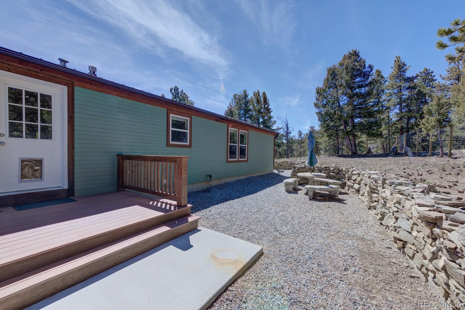 1373 Singletree Road Hartsel, CO 80449 - Photo 5 of 40 a view of backyard with a table and chairs
