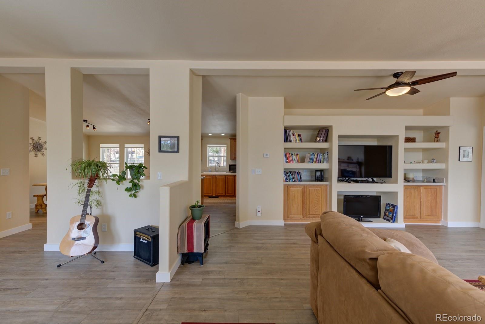1373 Singletree Road Hartsel, CO 80449 - Photo 8 of 40 a living room with furniture and a flat screen tv