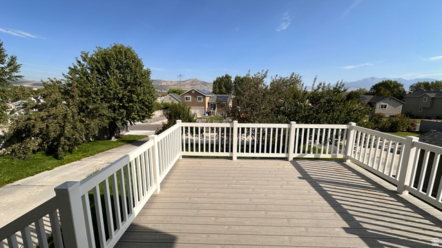3547 East Golden Eagle Road Eagle Mountain, UT 84005 - Photo 43 of 47 Wooden deck featuring a residential view and a mountain view