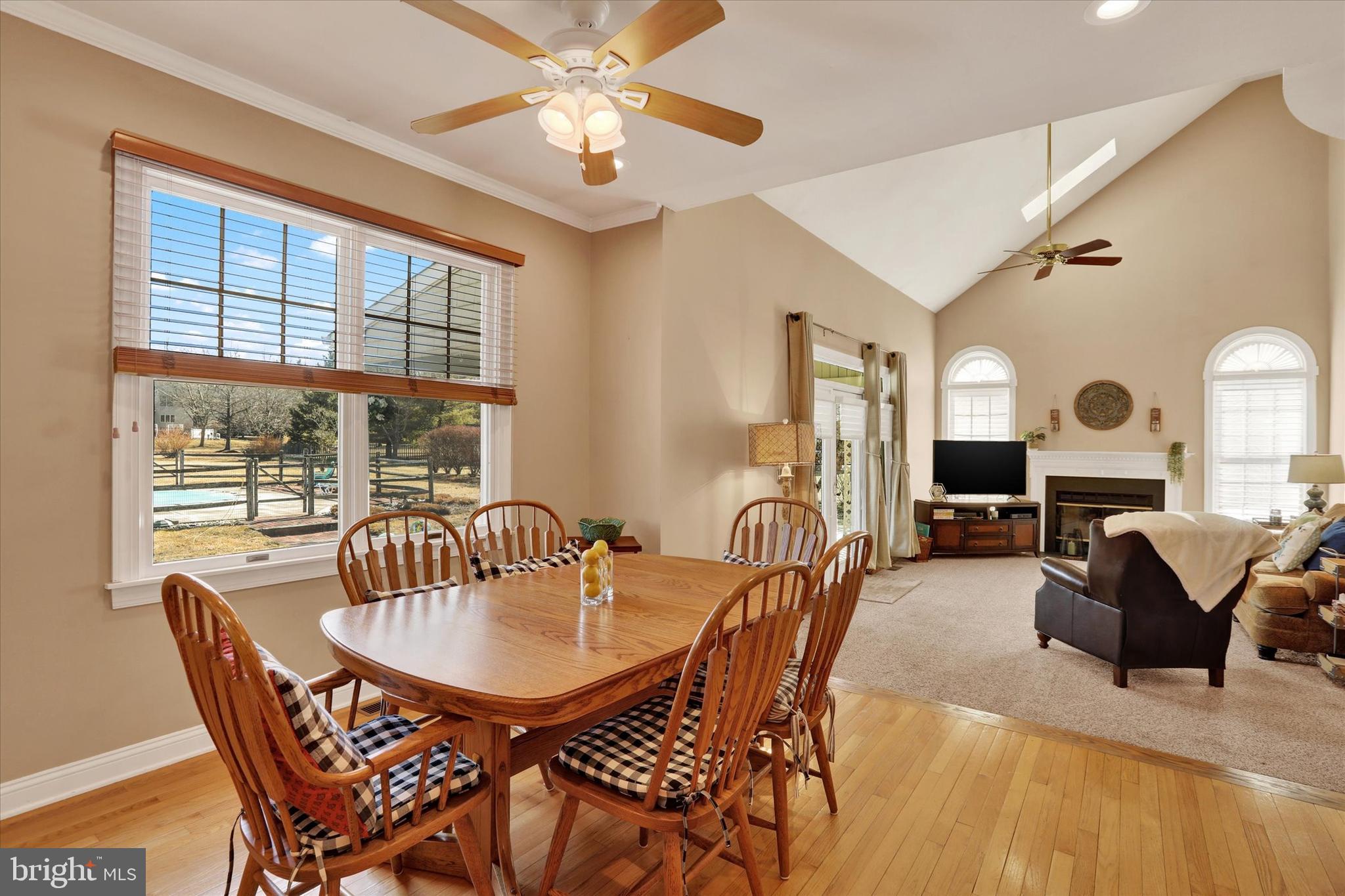 4615 Twinbrook Circle Doylestown, PA 18902 - Photo 11 of 30 a dining room with furniture a chandelier and wooden floor