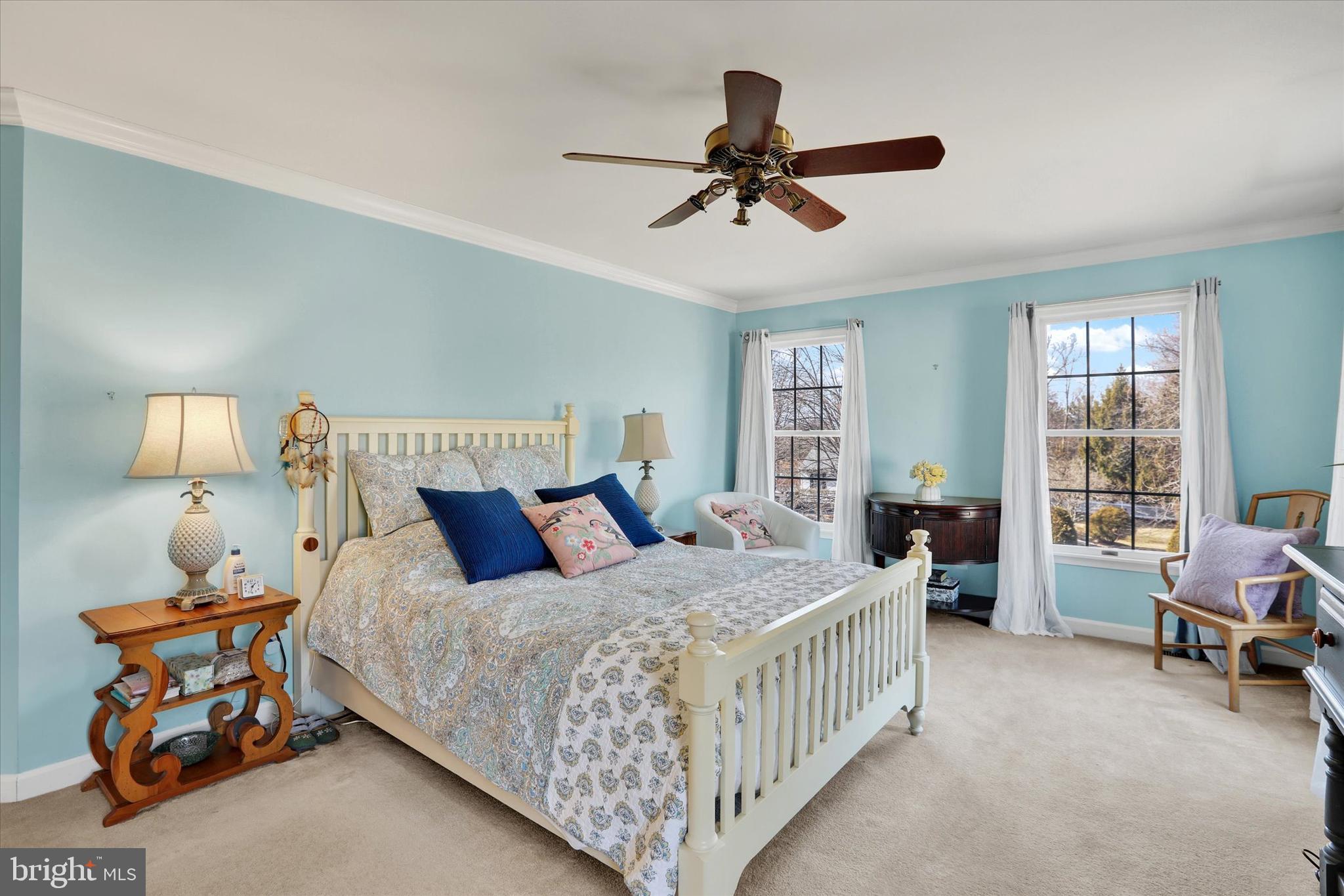 4615 Twinbrook Circle Doylestown, PA 18902 - Photo 16 of 30 a bedroom with a bed a chandelier and a couch