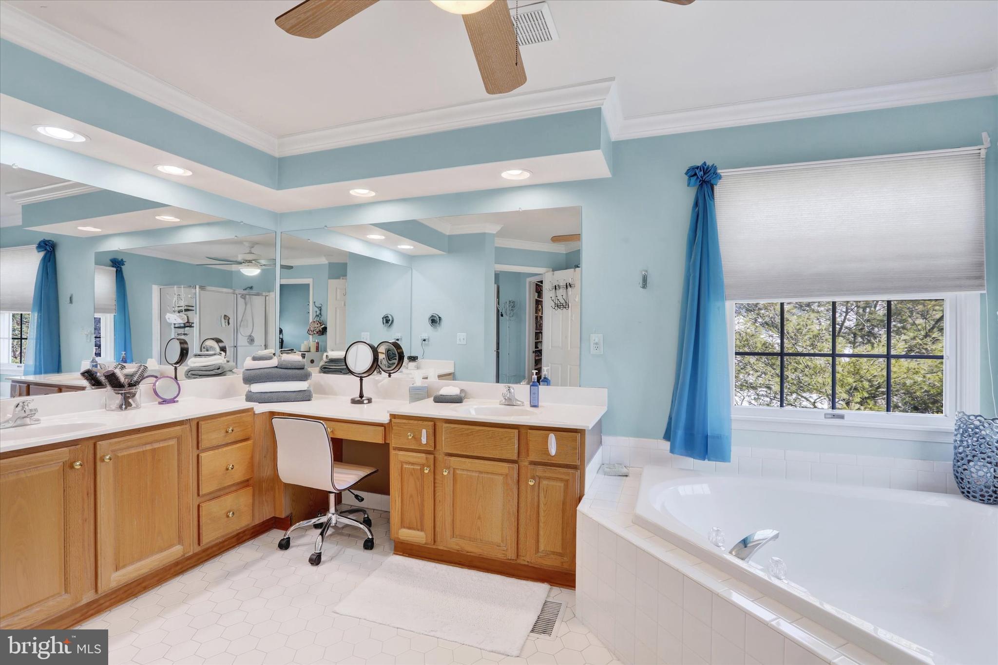 4615 Twinbrook Circle Doylestown, PA 18902 - Photo 18 of 30 a large white bathroom with a large tub sink vanity granite and a large window