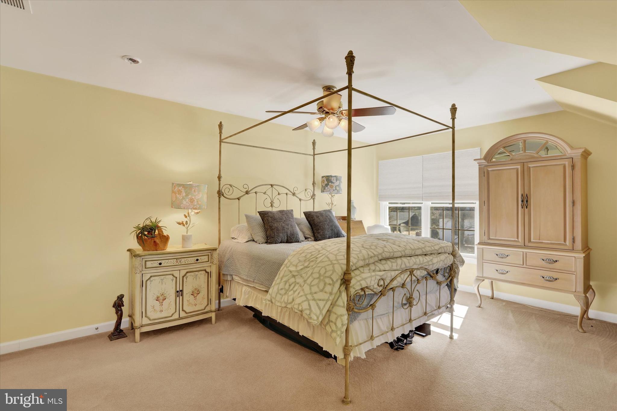4615 Twinbrook Circle Doylestown, PA 18902 - Photo 21 of 30 a bedroom with a bed a dresser and the view of the house