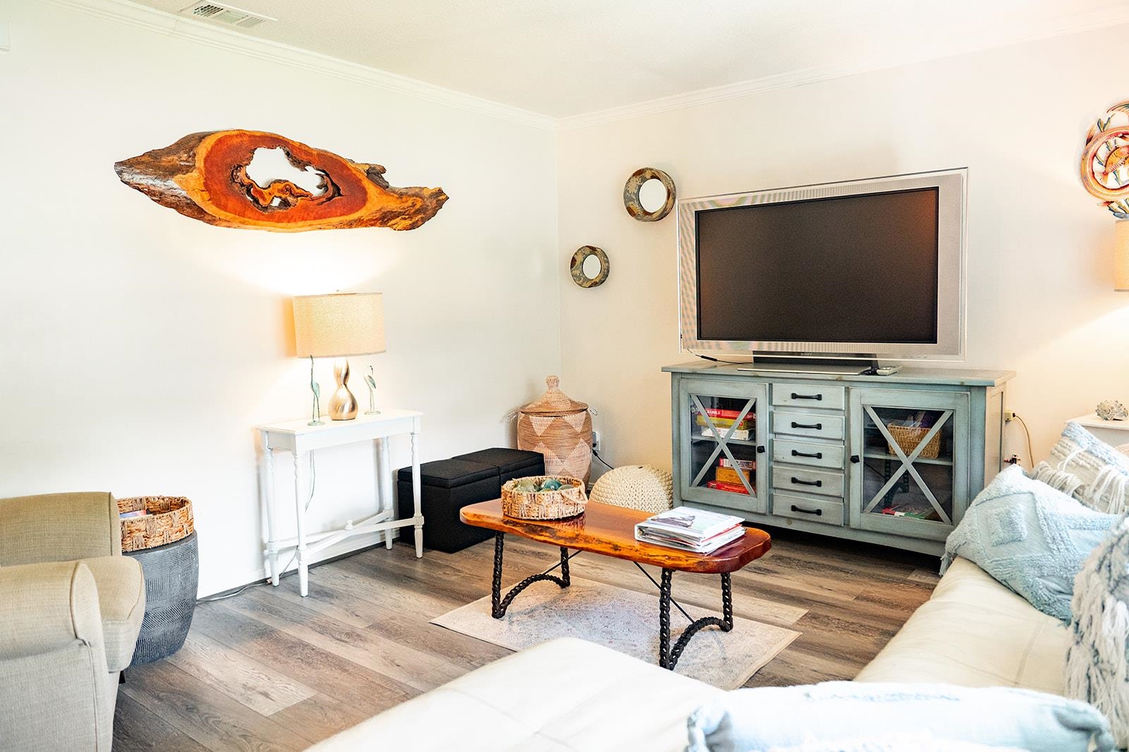 a living room with furniture and a flat screen tv