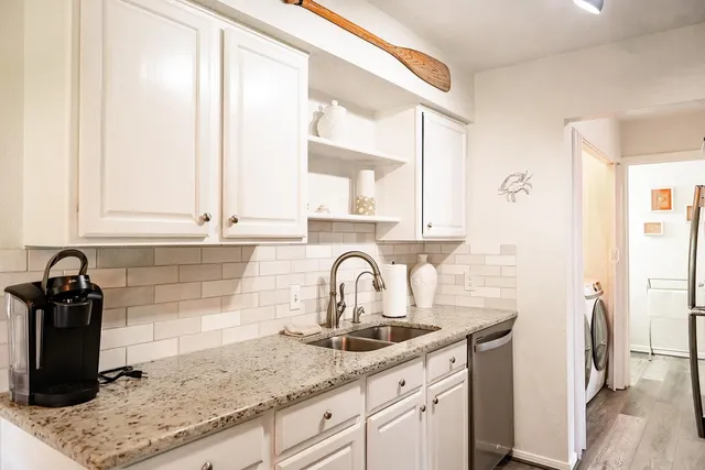 a kitchen with a sink and a window