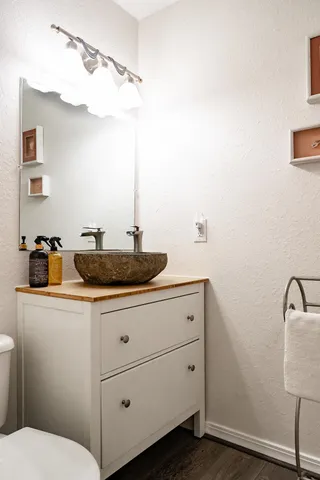 a bathroom with a sink and a mirror