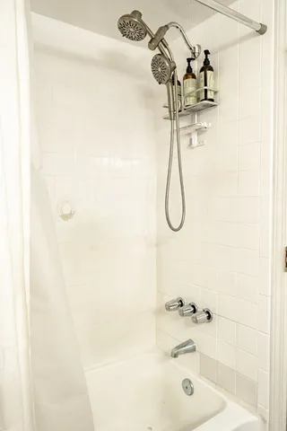 a bedroom with a bed and a table in it