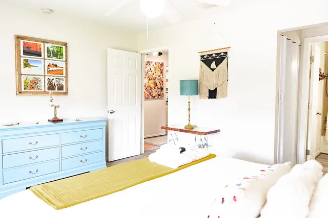 a bedroom with a bed and a window