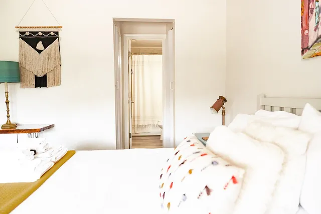 a bathroom with a granite countertop sink and a toilet