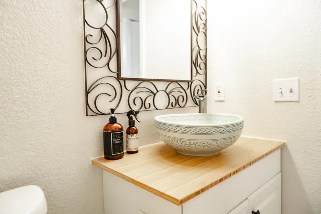 a close view of a sink and a mirror