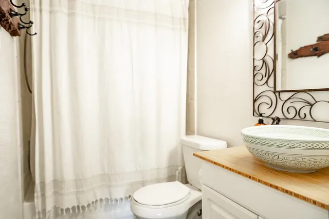 a view of a refrigerator and a stove in a room