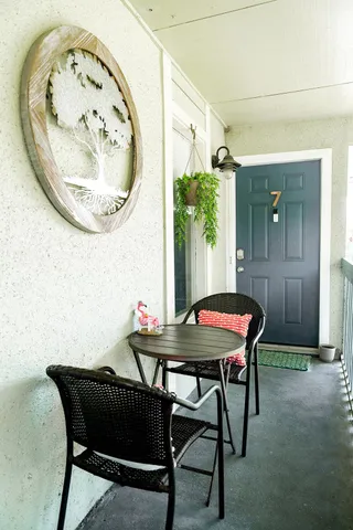 a view of a hallway with a wooden floor