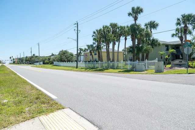a view of a swimming pool with a lounge chairs