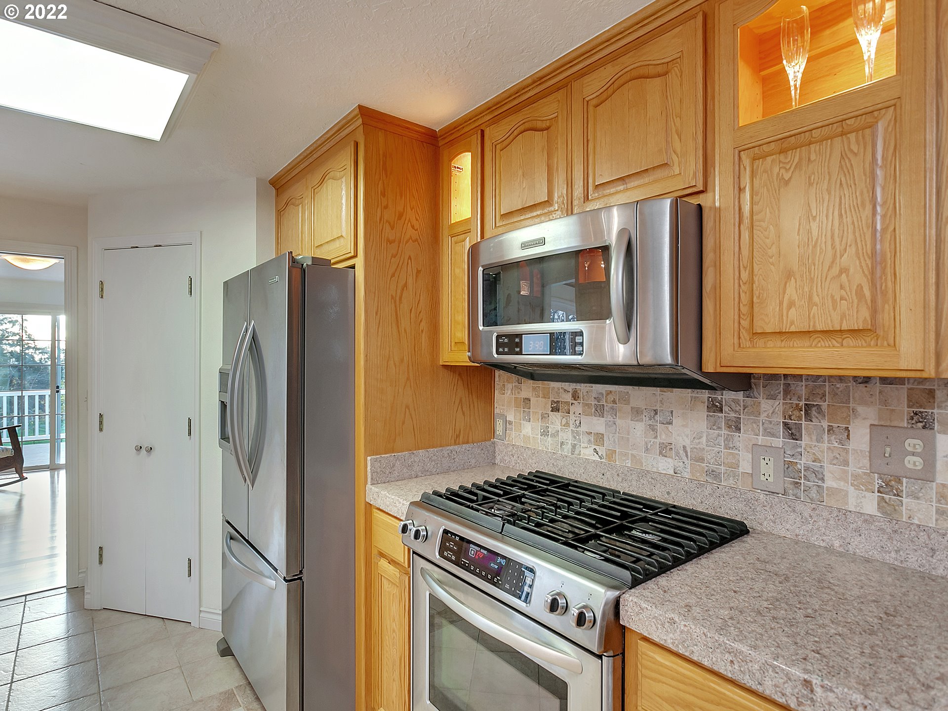 10292 Liberty Road South Salem, OR 97306 - Photo 9 of 32 a kitchen with stainless steel appliances granite countertop a refrigerator stove and microwave