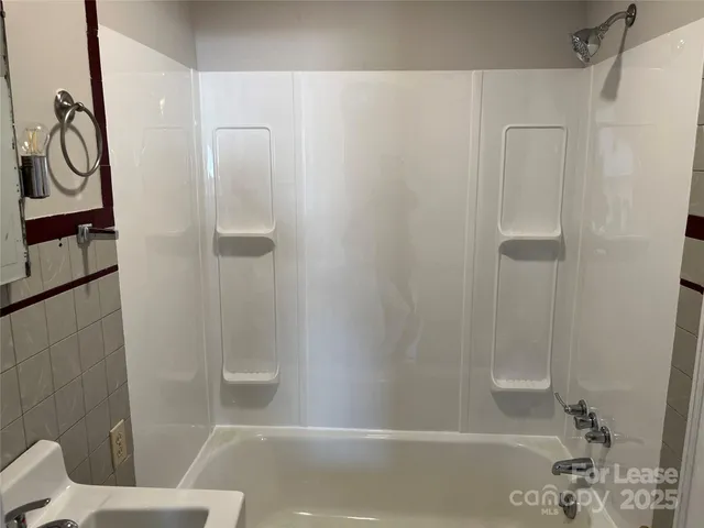 a bathroom with a shower and a toilet
