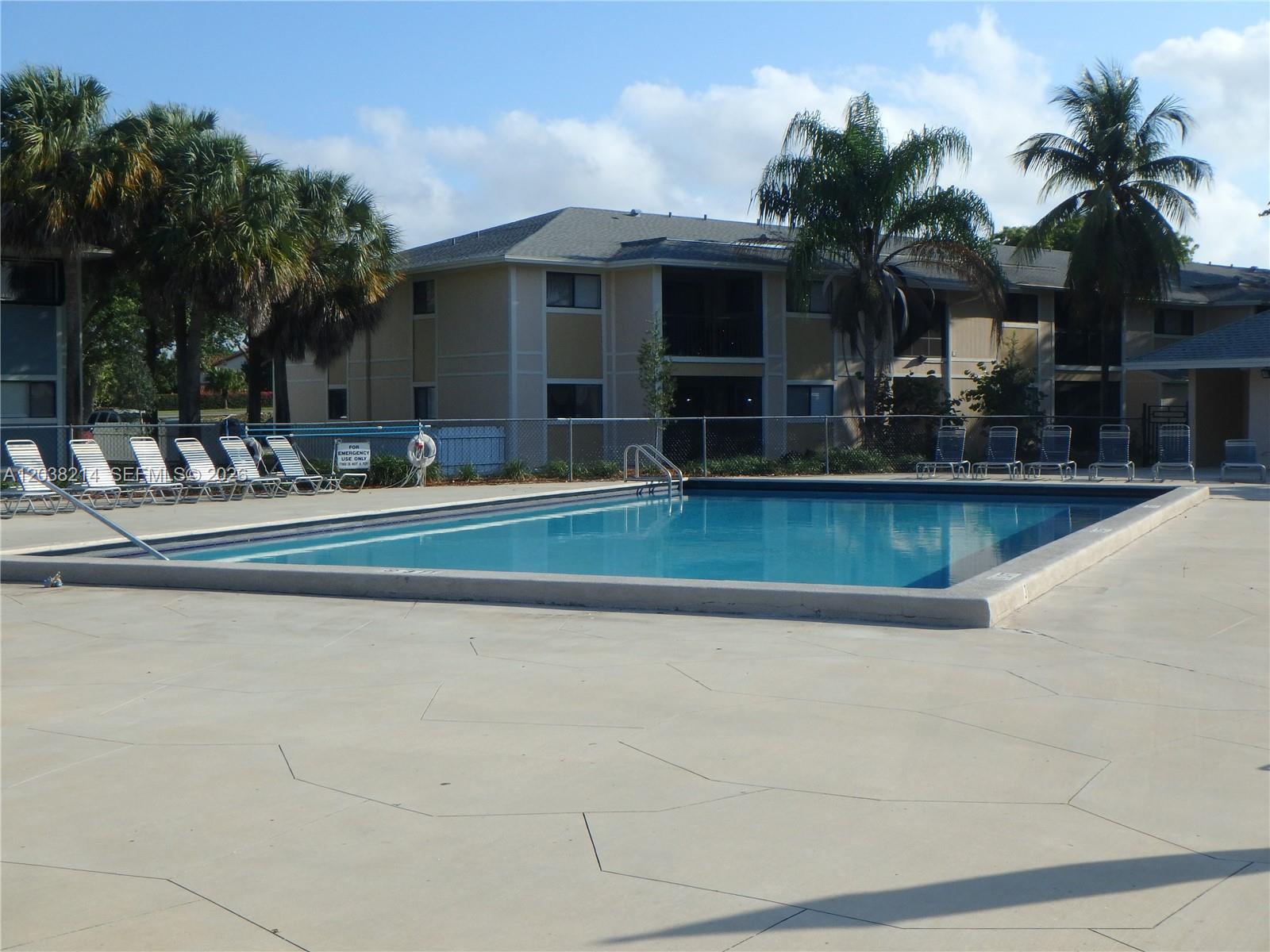 9727 Hammocks Boulevard, Unit 101D Miami, FL 33196 - Photo 3 of 12 a view of a house with swimming pool and sitting area
