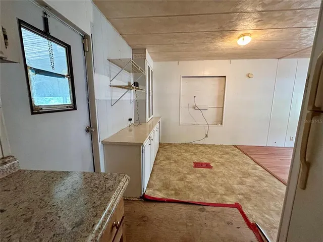 a bedroom with a bed and a dresser in it