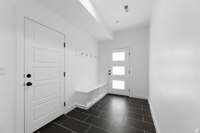 14392 South Champ Cove Draper, UT 84020 - Photo 28 of 31 Mudroom with baseboards and dark tile patterned flooring
