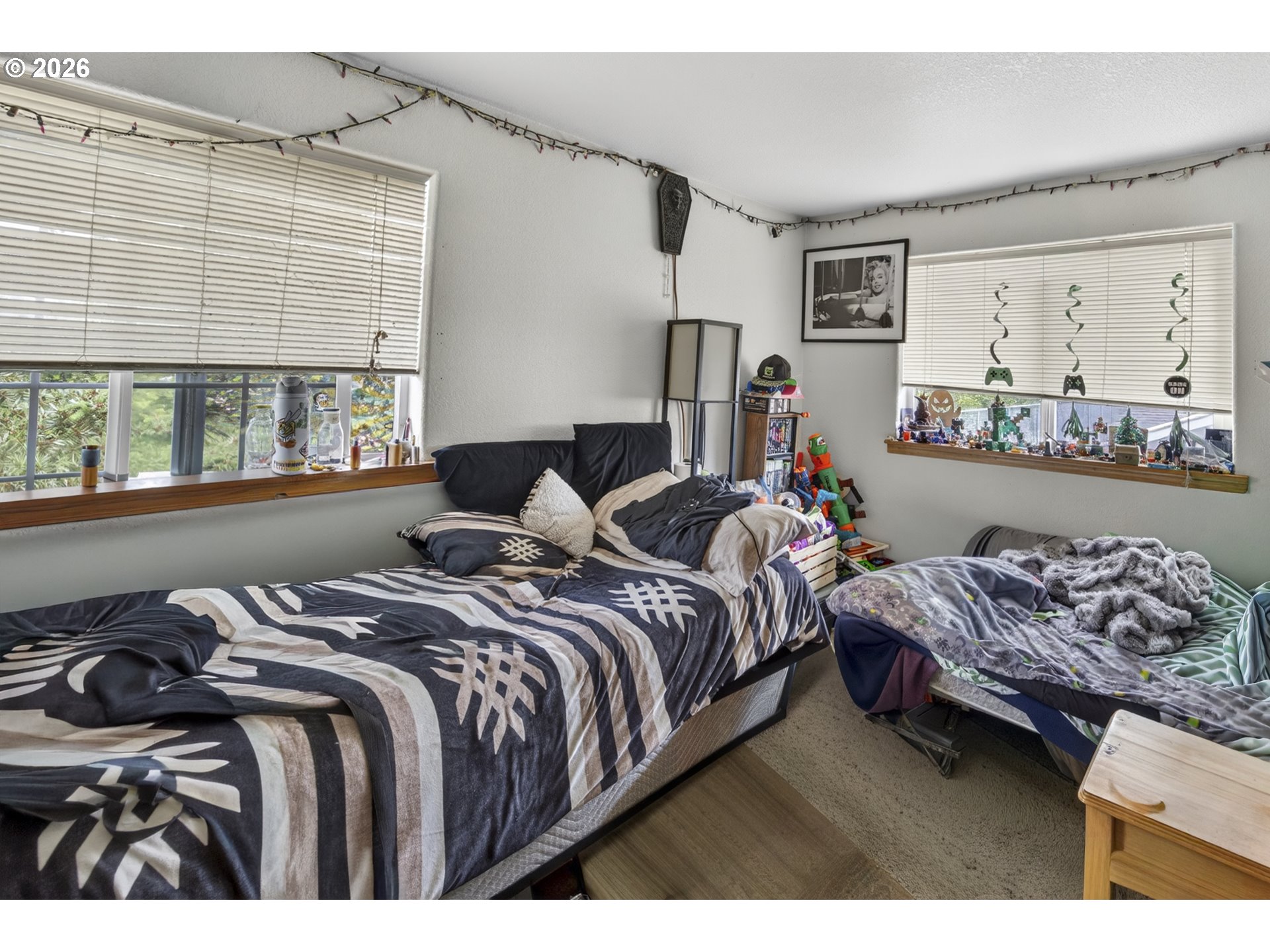 1150 Hemlock Street, Unit B8 Florence, OR 97439 - Photo 14 of 24 a bedroom with bed and window