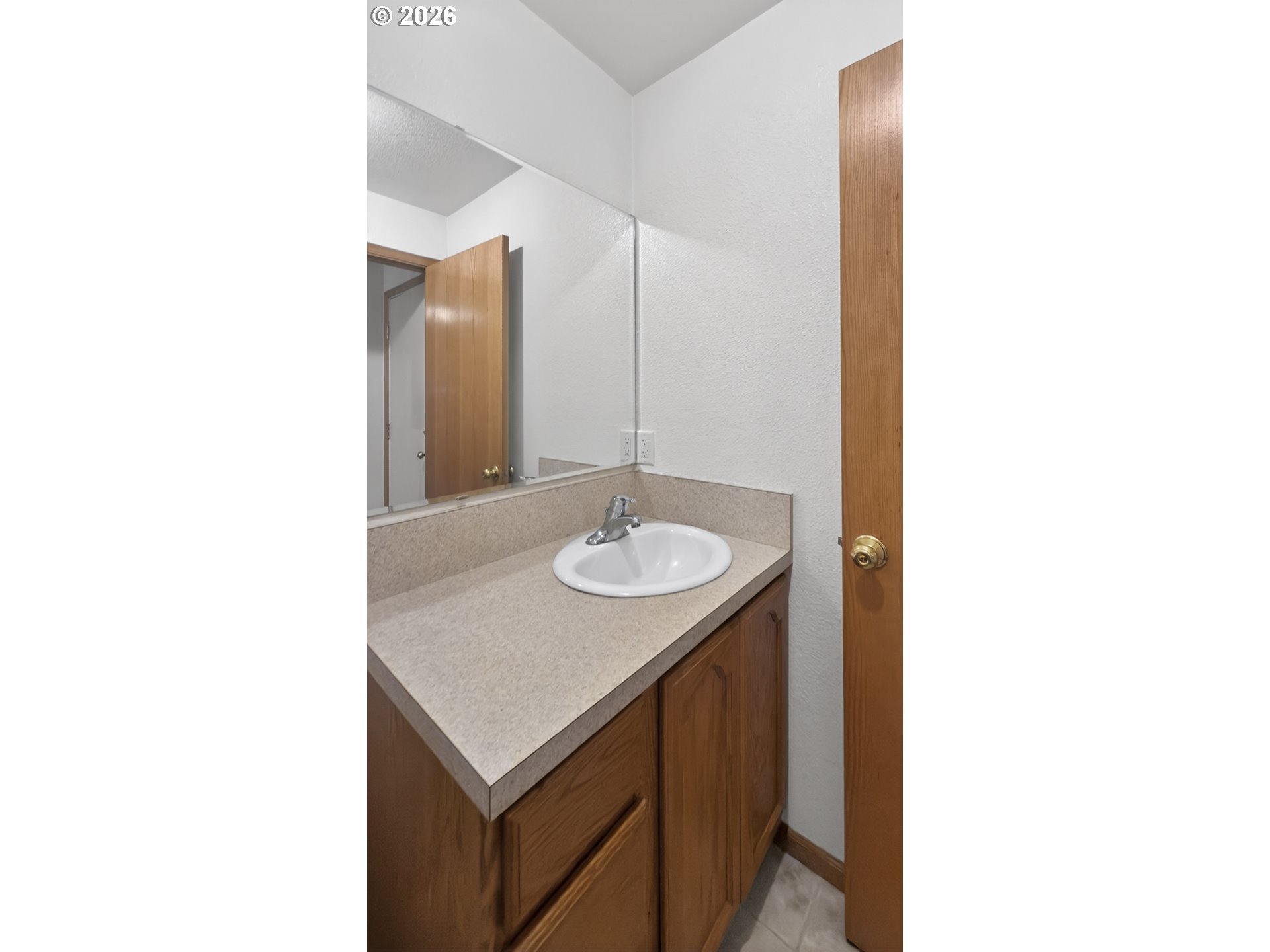 1150 Hemlock Street, Unit B8 Florence, OR 97439 - Photo 18 of 24 a bathroom with a sink and a mirror