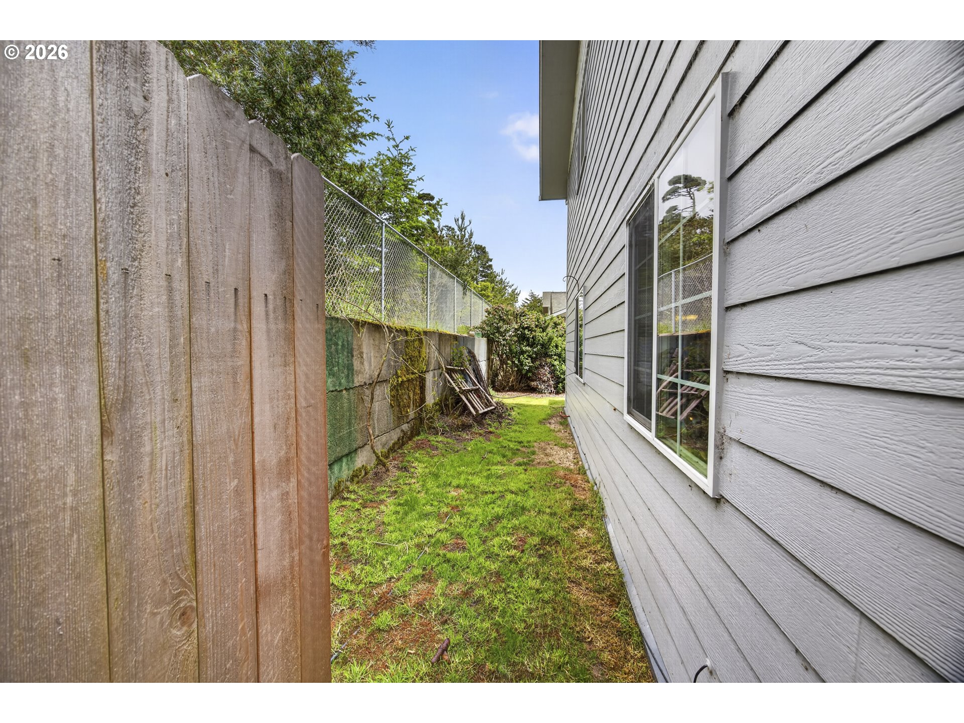 1150 Hemlock Street, Unit B8 Florence, OR 97439 - Photo 22 of 24 a view of backyard of the house