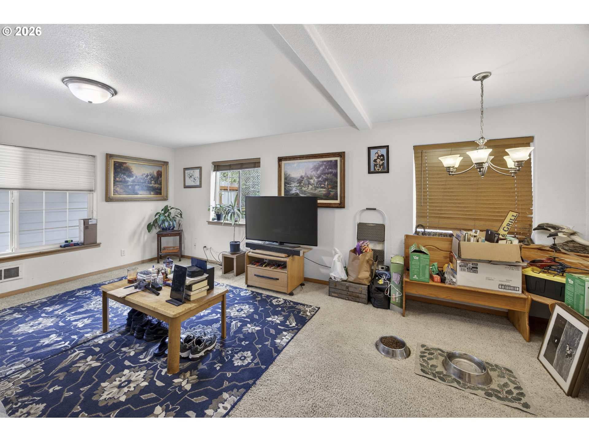 1150 Hemlock Street, Unit B8 Florence, OR 97439 - Photo 6 of 24 a living room with furniture and a flat screen tv