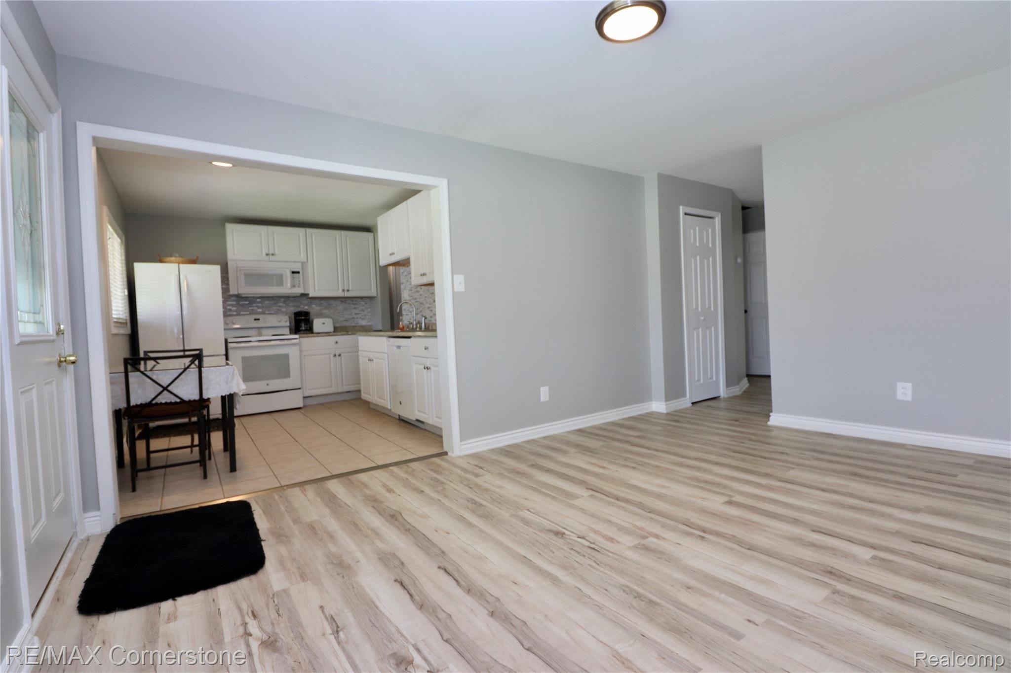 22345 Wick Road Taylor, MI 48180 - Photo 6 of 19 Living room looking into Kitchen