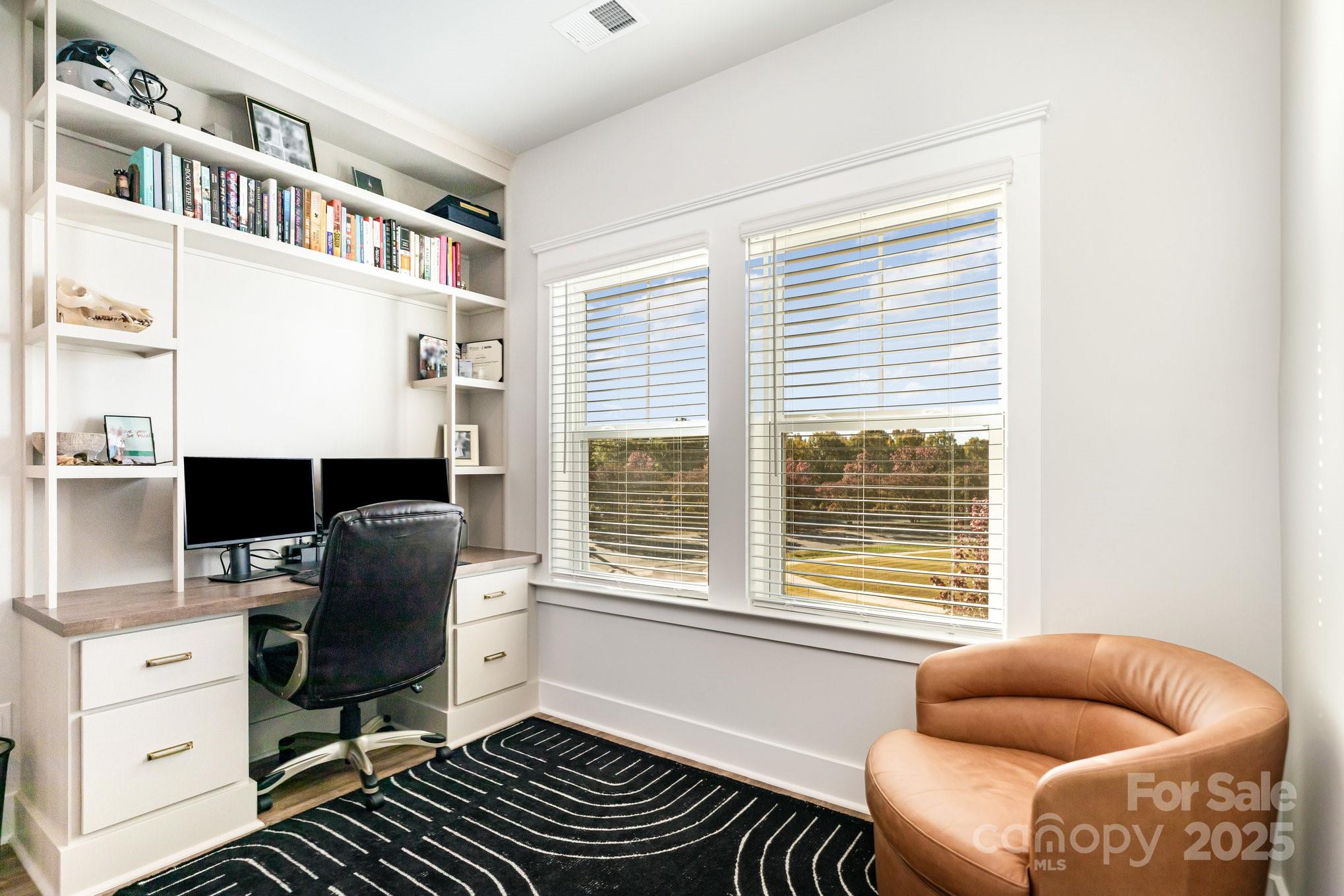 8014 Houser Street Cornelius, NC 28031 - Photo 11 of 24 a livingroom with workspace and a window