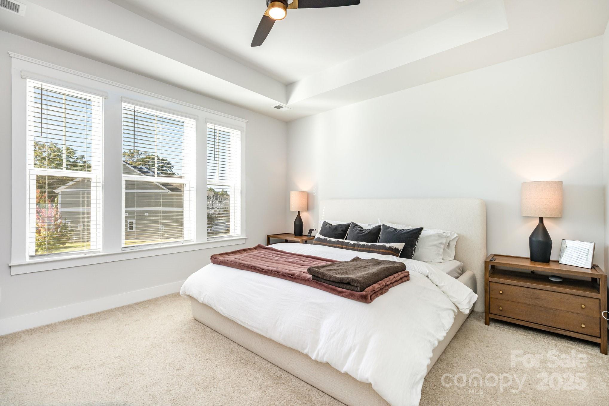 8014 Houser Street Cornelius, NC 28031 - Photo 14 of 24 a bedroom with a bed and a window