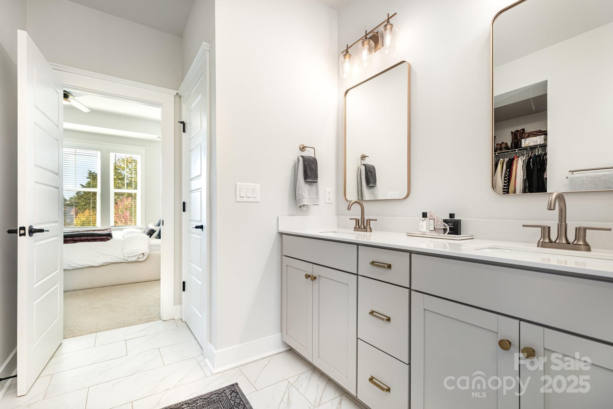 8014 Houser Street Cornelius, NC 28031 - Photo 16 of 24 a spacious bathroom with a double vanity sink mirror and