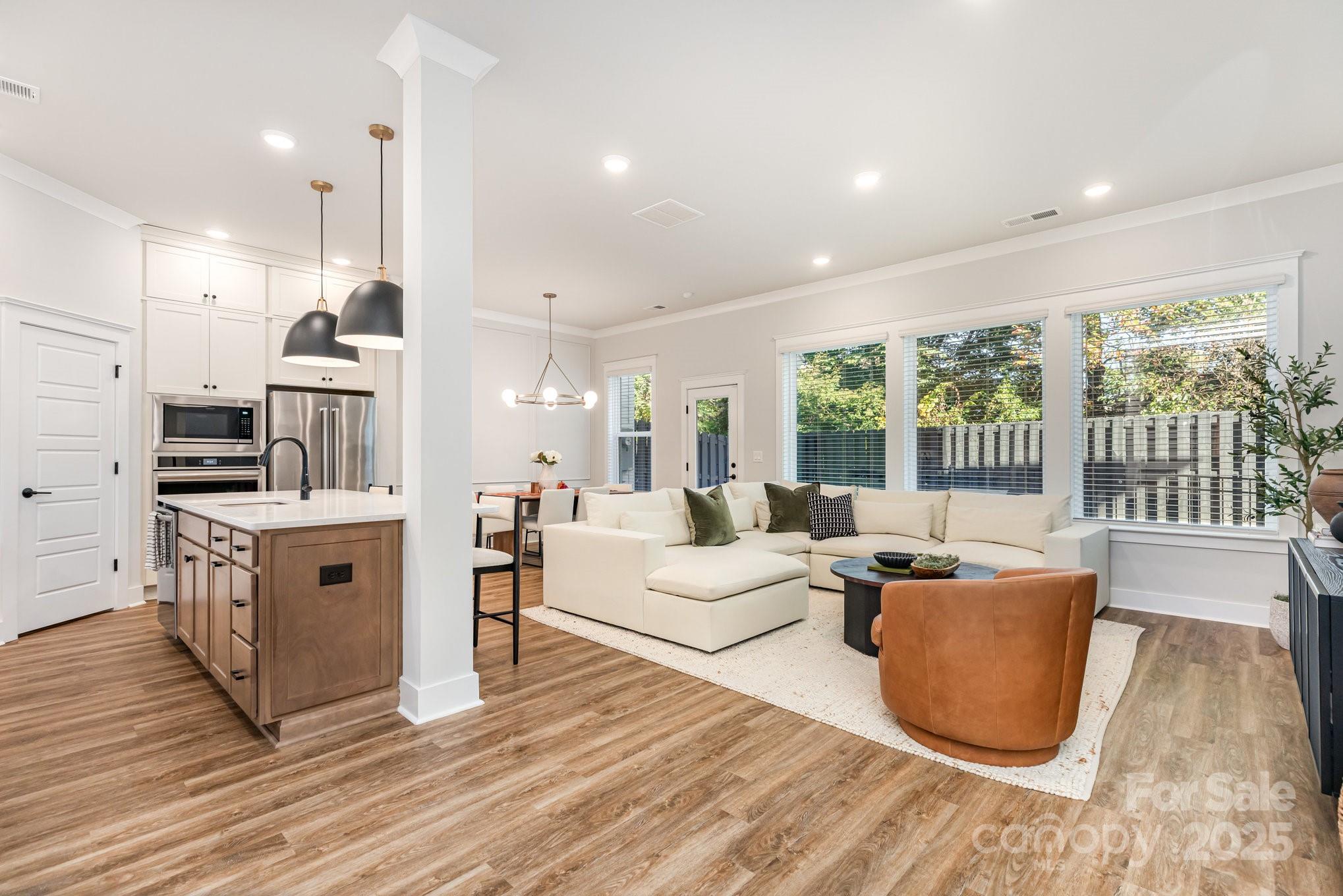8014 Houser Street Cornelius, NC 28031 - Photo 2 of 24 a living room with furniture and a large window