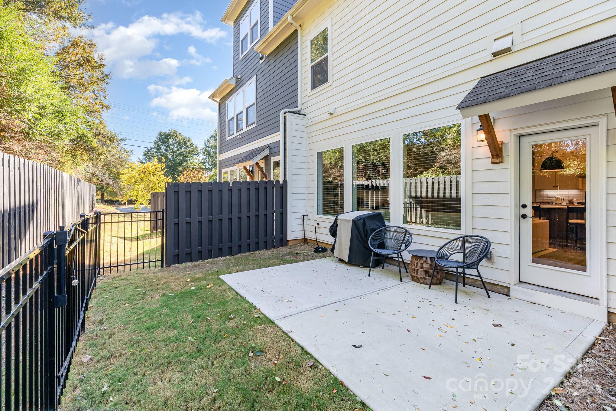 8014 Houser Street Cornelius, NC 28031 - Photo 22 of 24 a view of a backyard with furniture