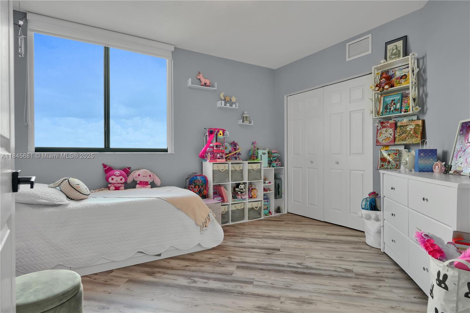 4242 Northwest 2nd Street, Unit 804 Miami, FL 33126 - Photo 14 of 30 a bedroom with a bed and a window