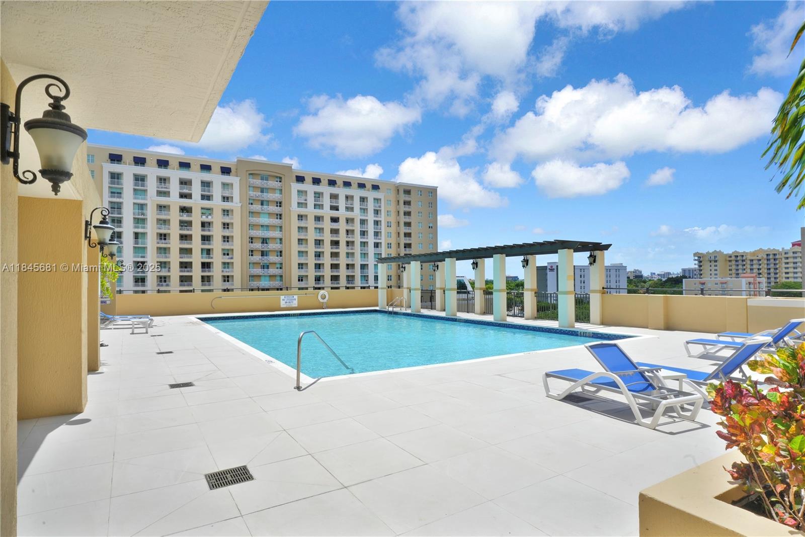 4242 Northwest 2nd Street, Unit 804 Miami, FL 33126 - Photo 28 of 30 a view of swimming pool with seating space
