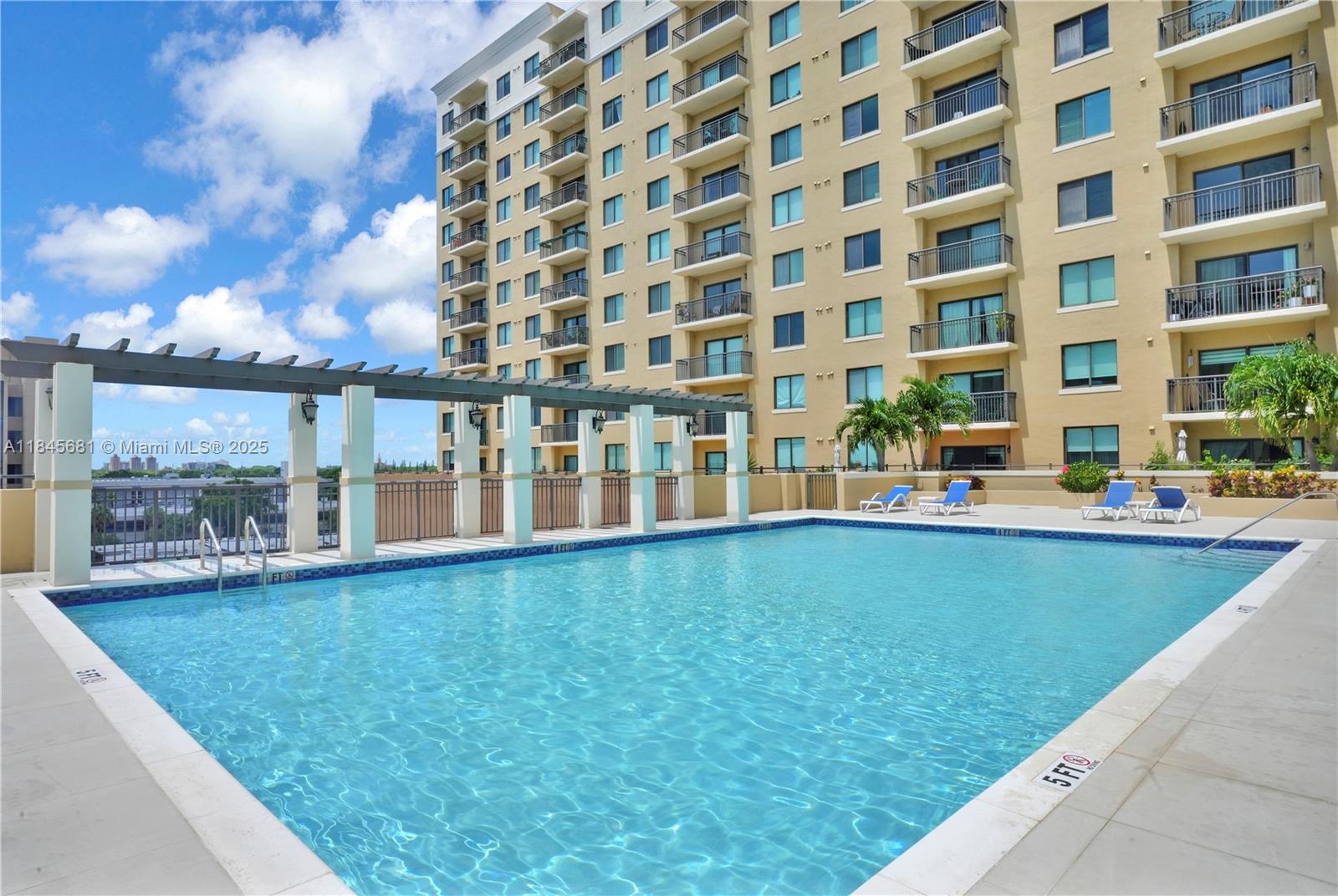 4242 Northwest 2nd Street, Unit 804 Miami, FL 33126 - Photo 29 of 30 a view of a building with a swimming pool