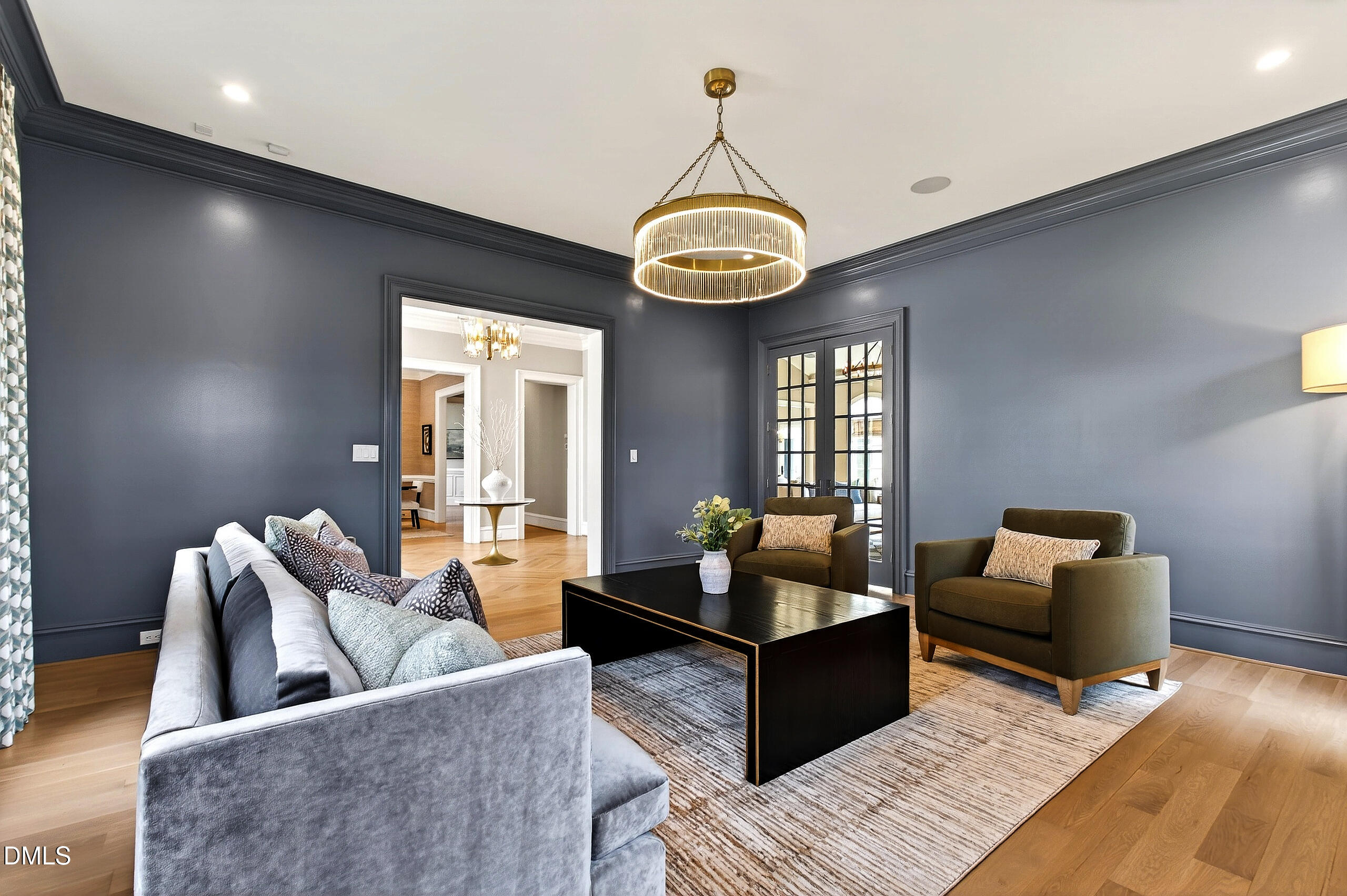 1404 Rock Dam Court Raleigh, NC 27615 - Photo 14 of 97 a living room with furniture wooden floor and a chandelier