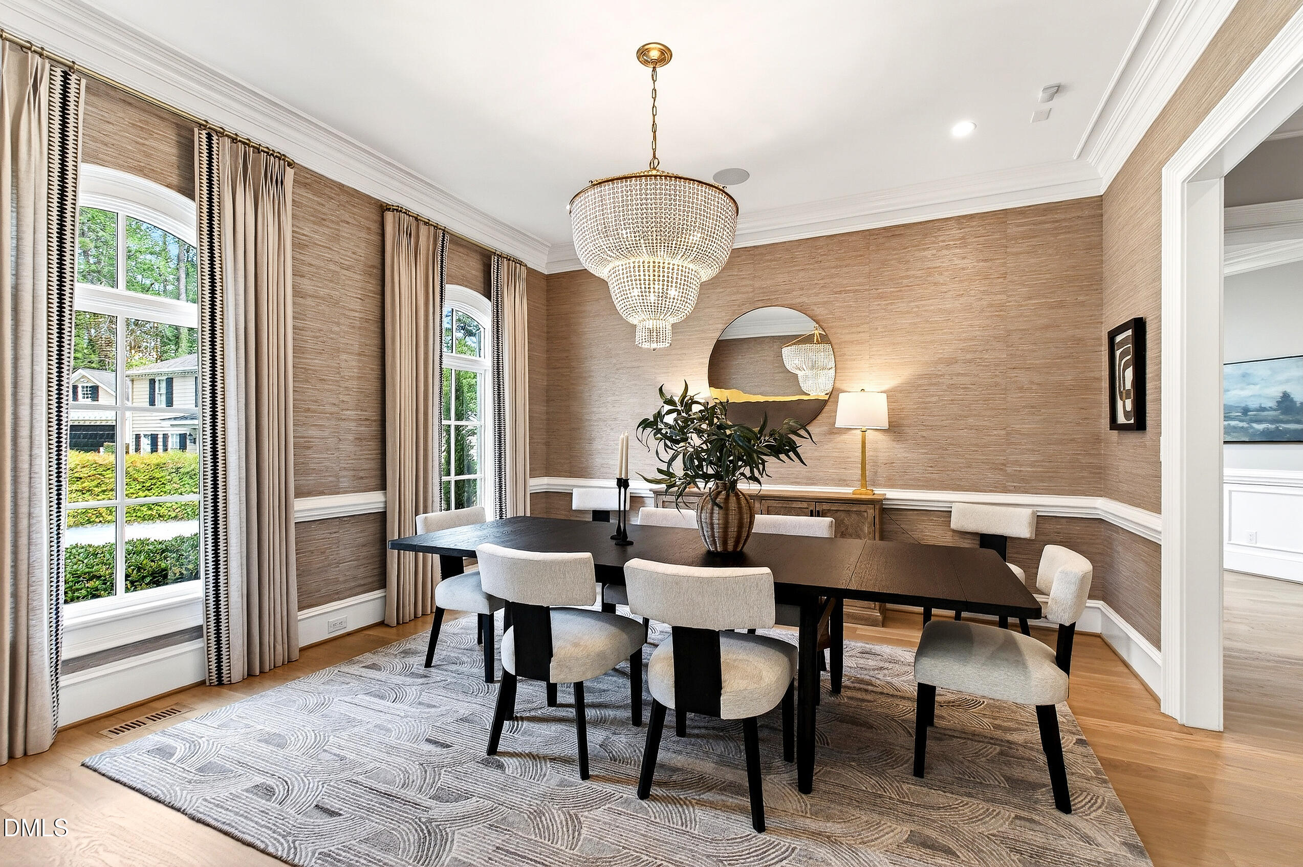 1404 Rock Dam Court Raleigh, NC 27615 - Photo 15 of 97 a dining room with furniture a chandelier and wooden floor