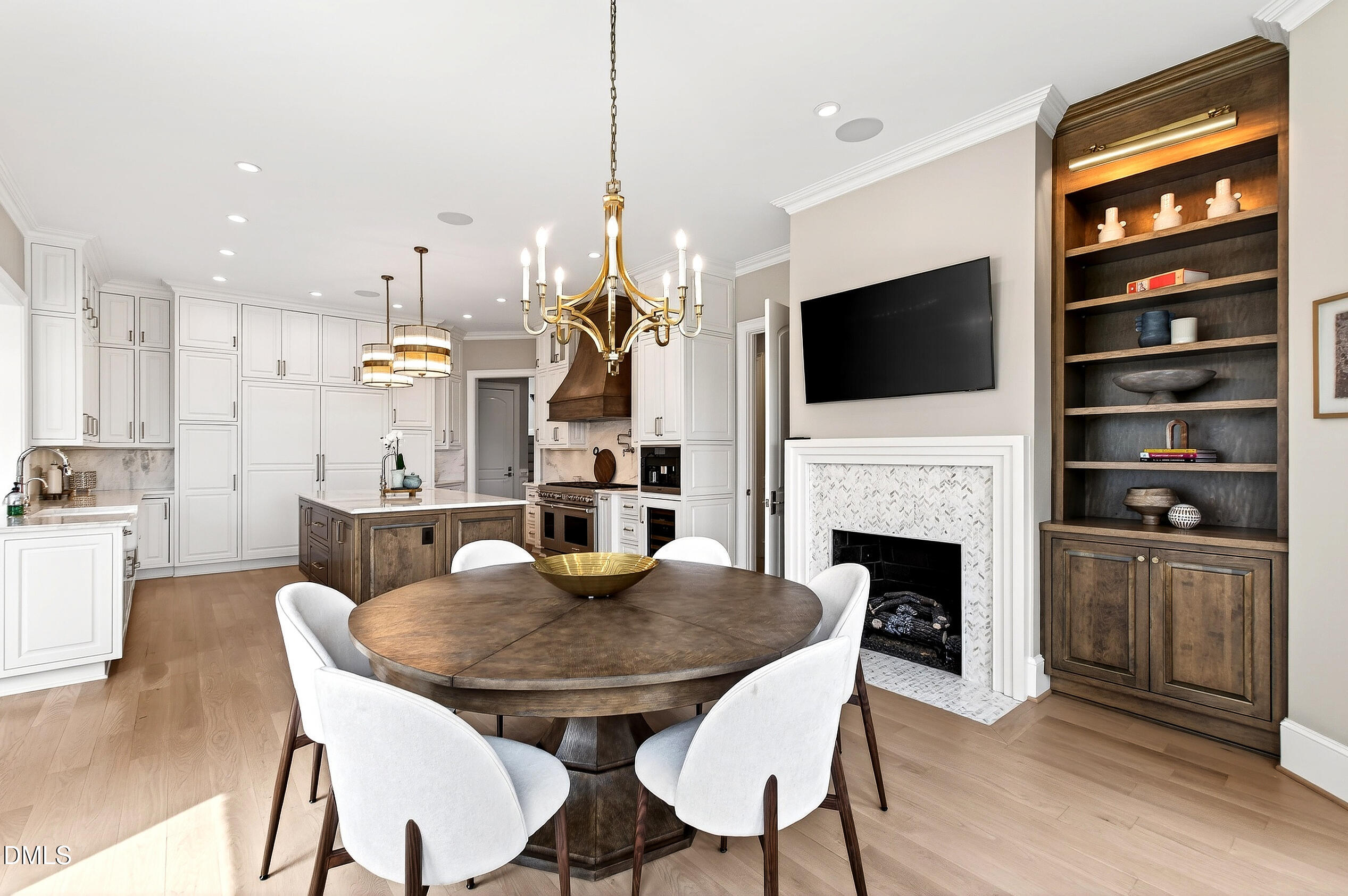 1404 Rock Dam Court Raleigh, NC 27615 - Photo 32 of 97 a view of a dining room with furniture a fireplace and wooden floor