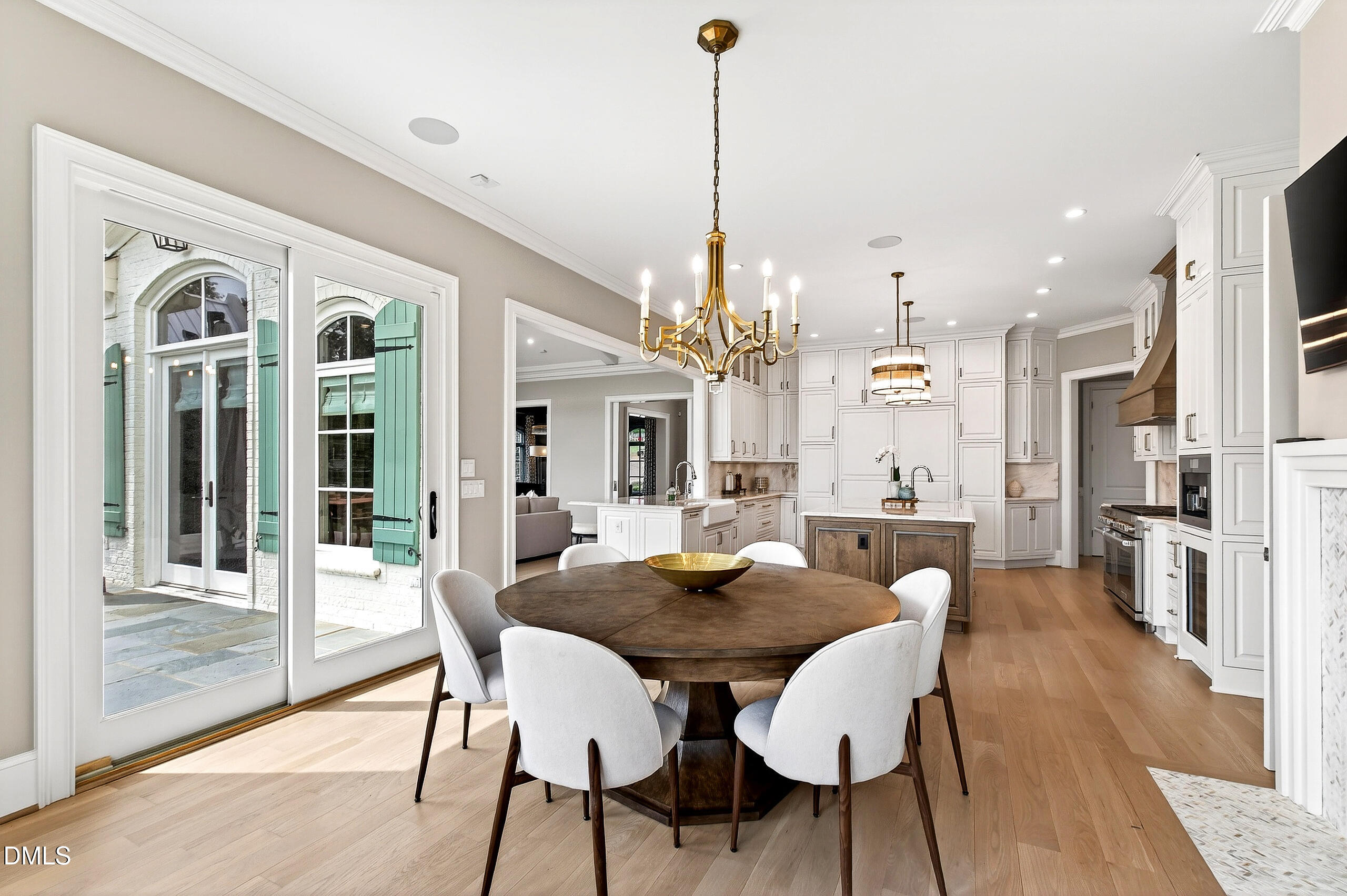 1404 Rock Dam Court Raleigh, NC 27615 - Photo 33 of 97 a view of a dining room and livingroom with furniture wooden floor a chandelier