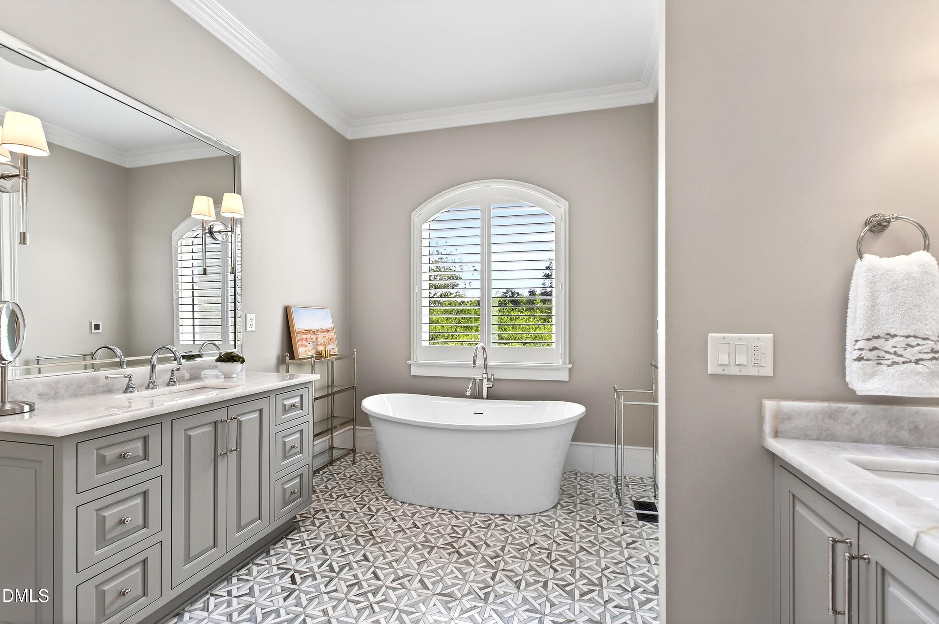 1404 Rock Dam Court Raleigh, NC 27615 - Photo 43 of 97 a spacious bathroom with a bathtub sink and mirror