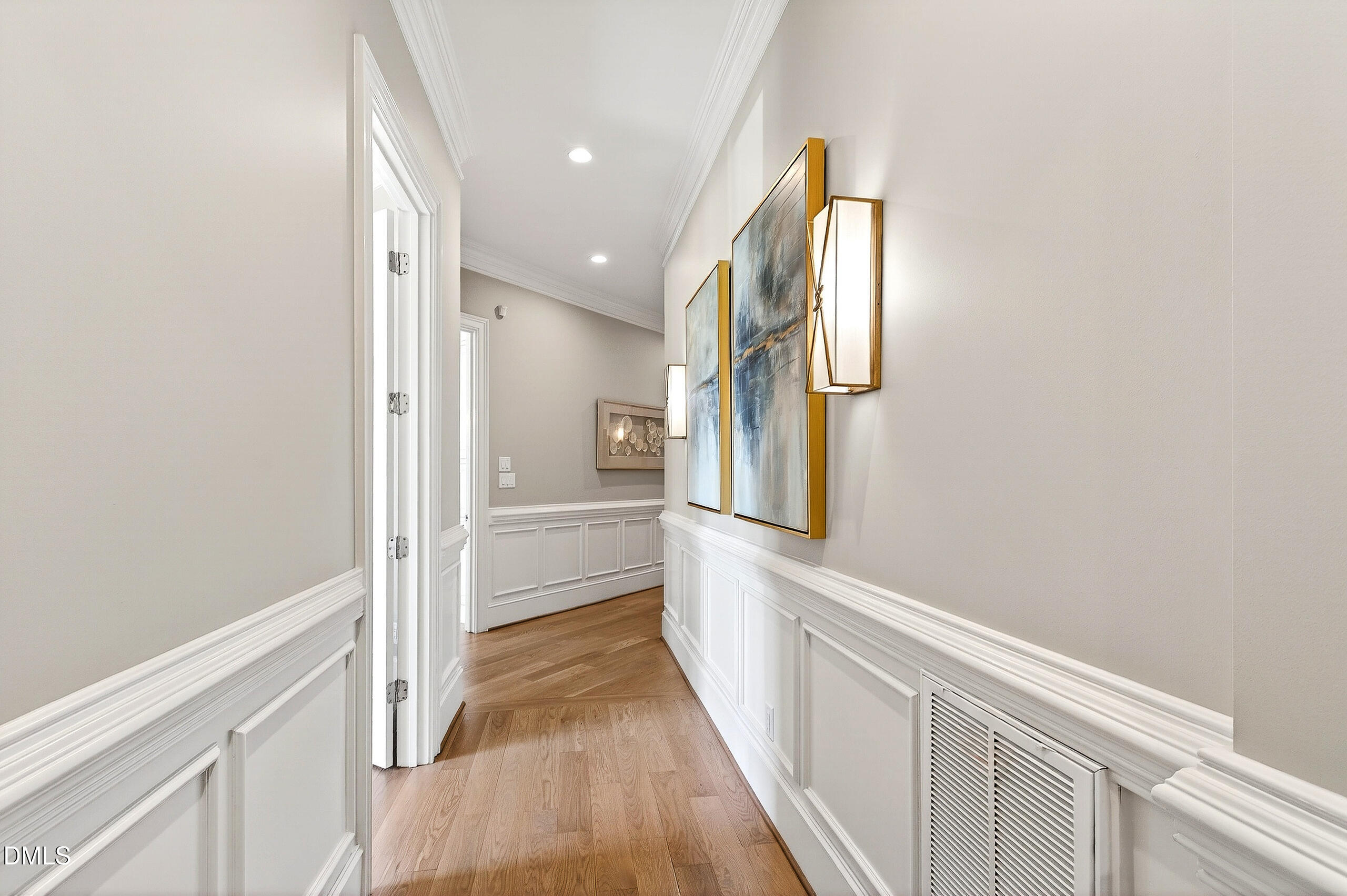 1404 Rock Dam Court Raleigh, NC 27615 - Photo 53 of 97 a view of a hallway with wooden floor and staircase