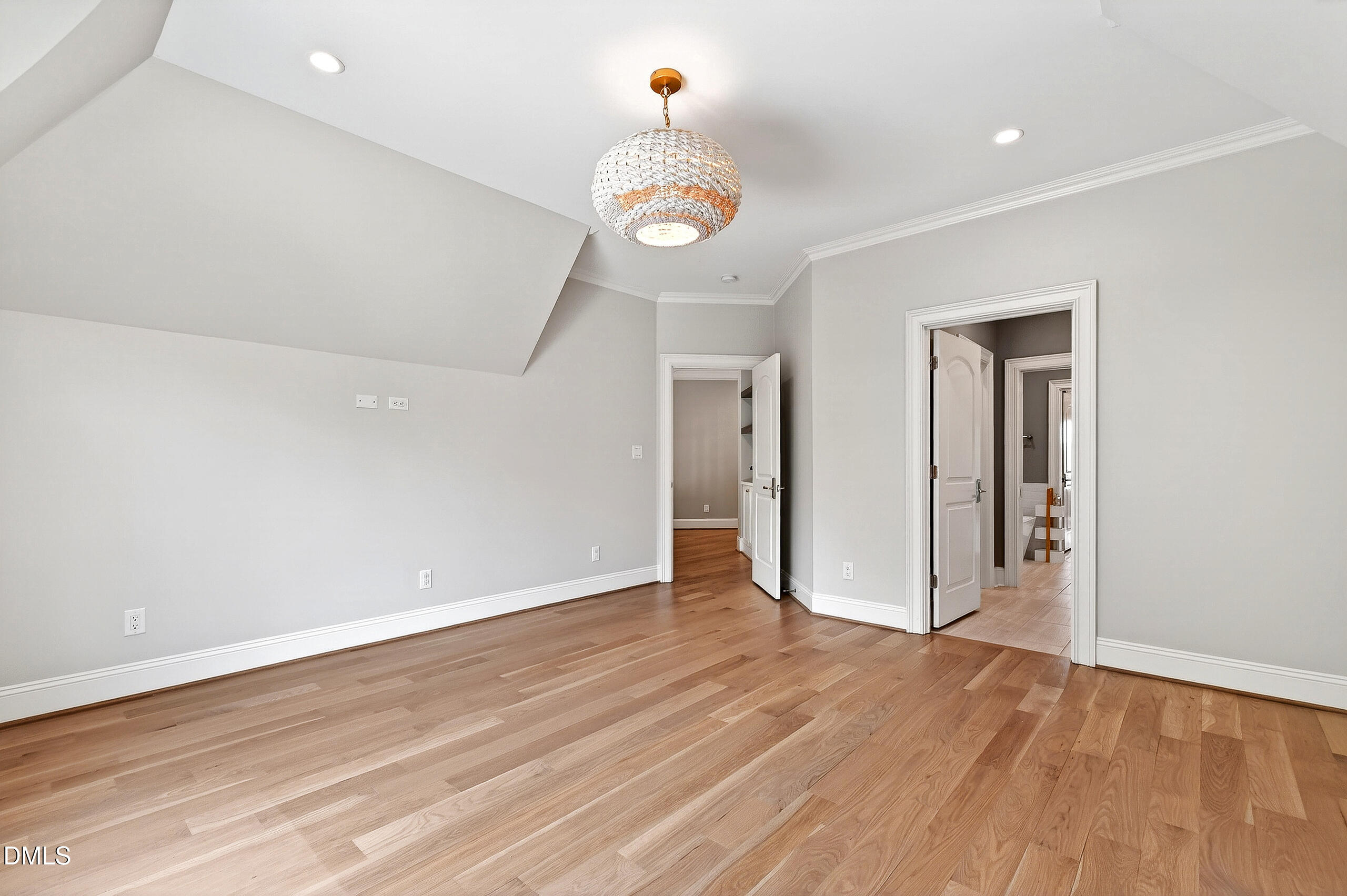 1404 Rock Dam Court Raleigh, NC 27615 - Photo 62 of 97 a view of an empty room with wooden floor and a window