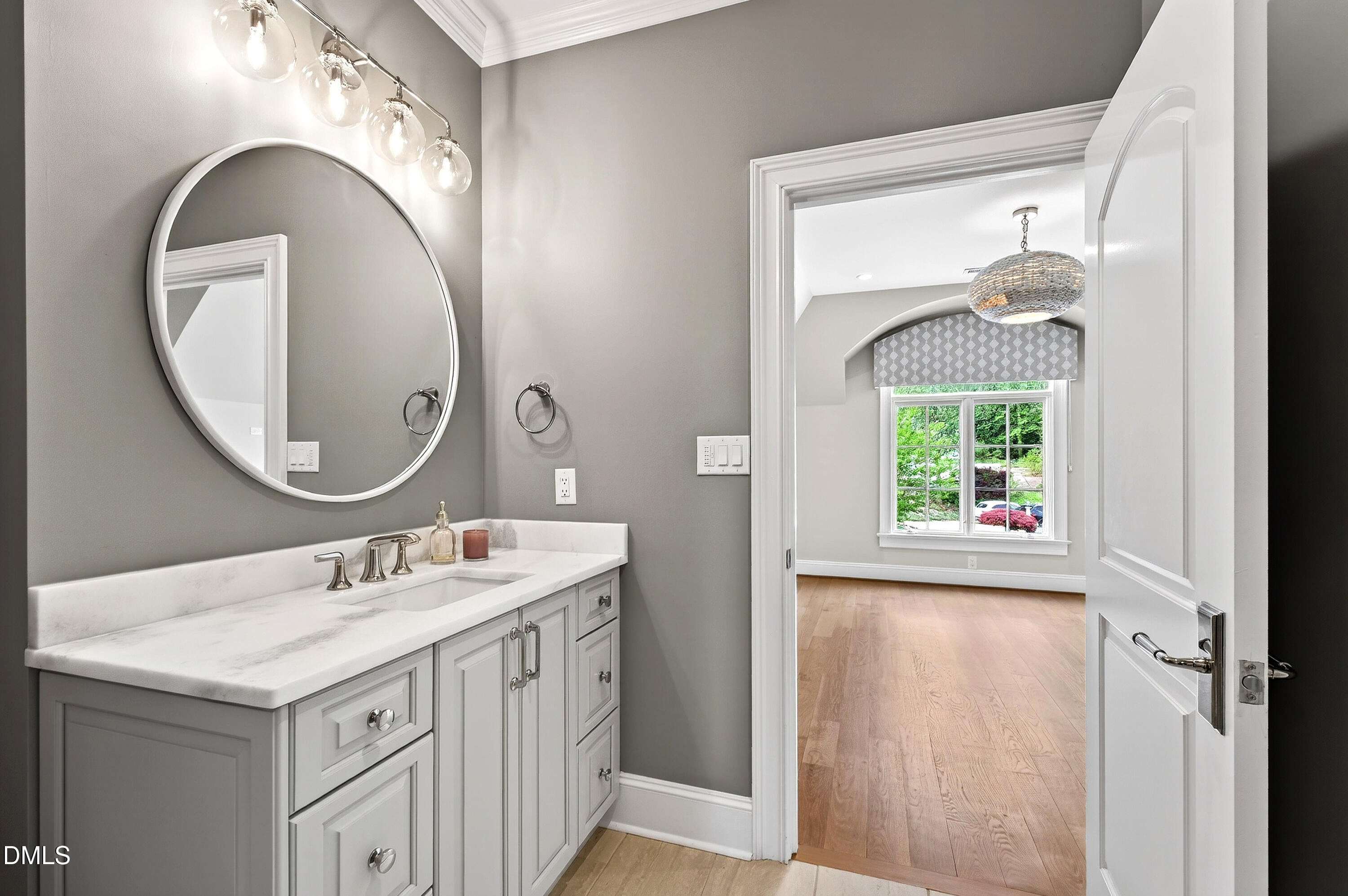 1404 Rock Dam Court Raleigh, NC 27615 - Photo 63 of 97 a bathroom with a sink and a mirror