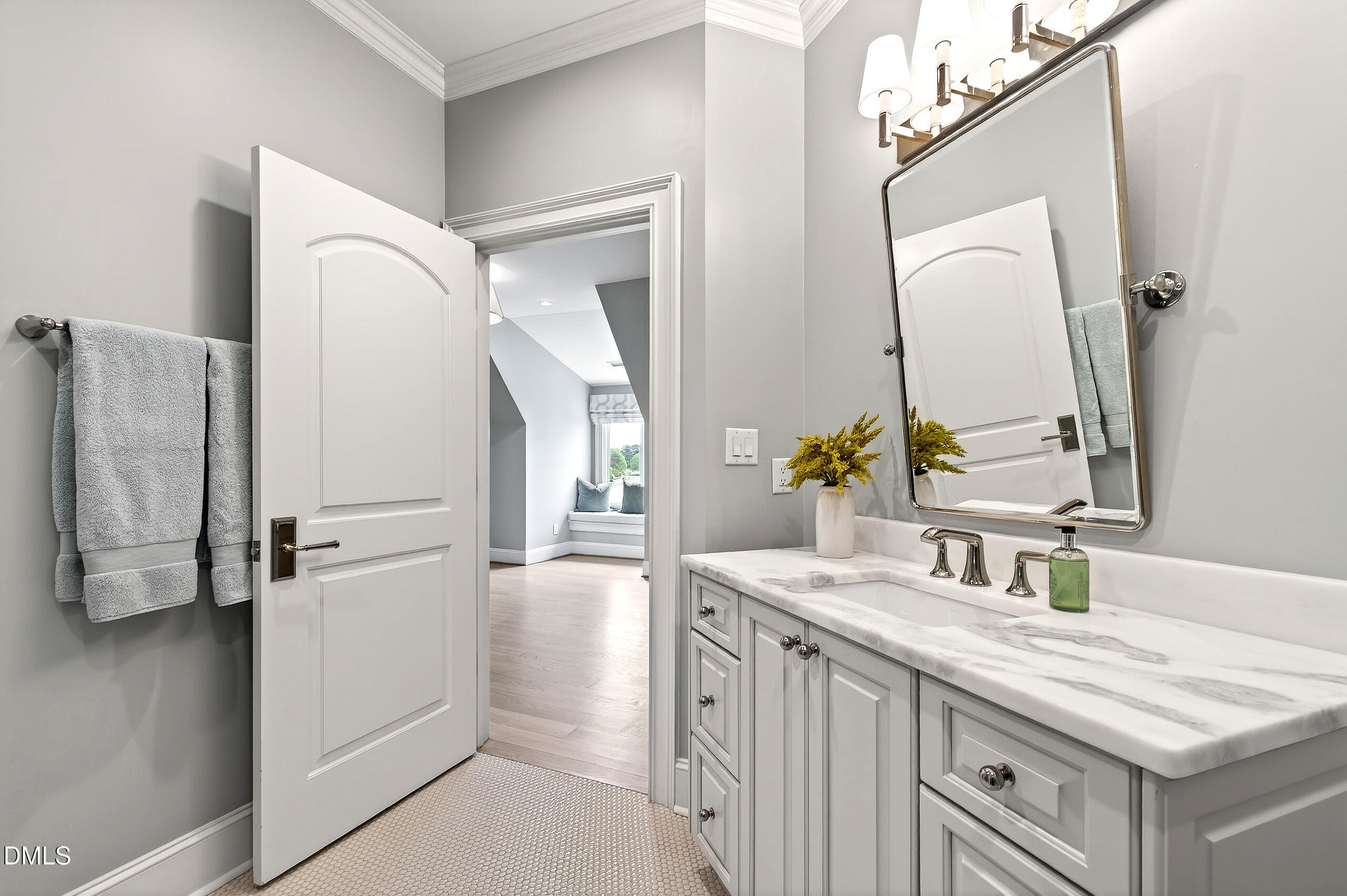 1404 Rock Dam Court Raleigh, NC 27615 - Photo 73 of 97 a bathroom with a sink vanity and a mirror