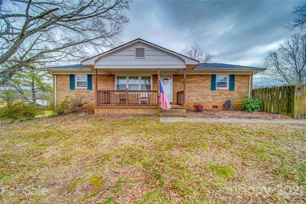1260 Goodnight Road Salisbury, NC 28147 - Photo 1 of 13 a front view of a house with a yard and outdoor seating