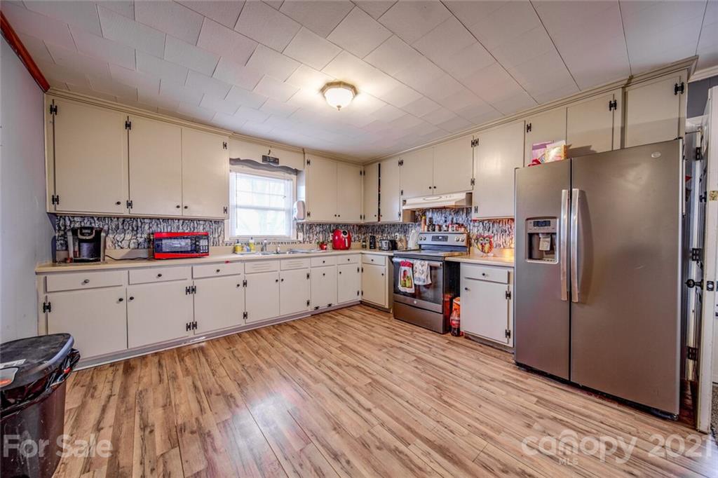 1260 Goodnight Road Salisbury, NC 28147 - Photo 3 of 13 a kitchen with stainless steel appliances a refrigerator sink and cabinets